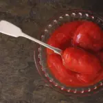 peeled tomatoes in a clear bowl with spoon 2026 01 09 14 45 09 utc | Dolce Parma