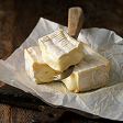 creamy cheese on rustic wooden cutting board 2026 03 25 05 11 52 utc 1 | Dolce Parma