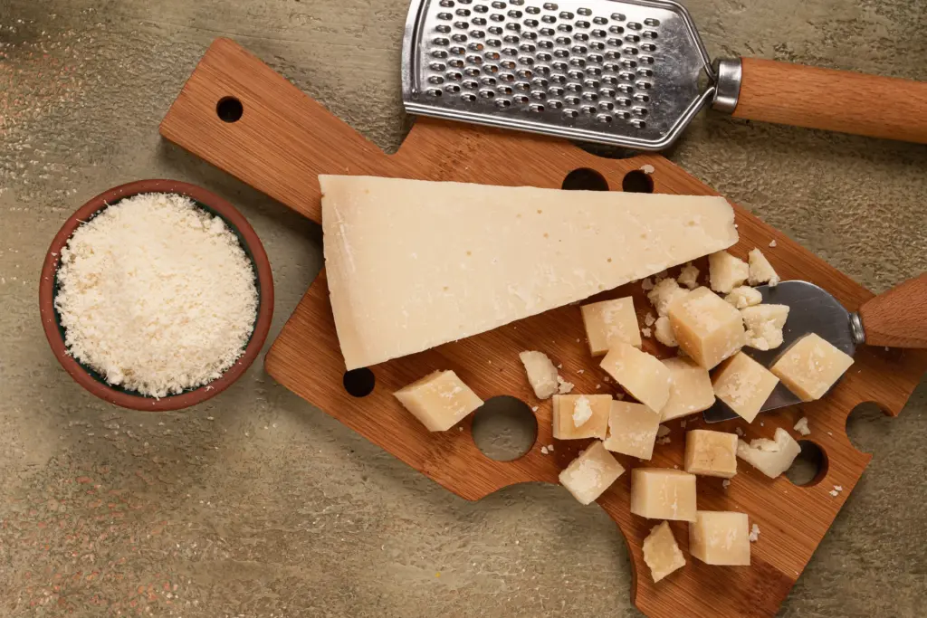 grated cheese on wooden cutting board still life 2026 01 27 00 41 42 utc | Dolce Parma
