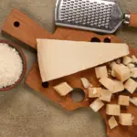 grated cheese on wooden cutting board still life 2026 01 27 00 41 42 utc | Dolce Parma